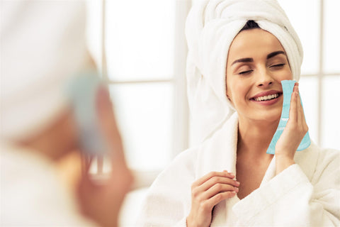 woman cleaning face with face towels | towelogy