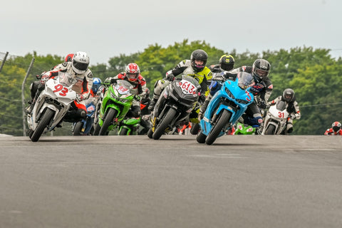 The busy CSBK National Amateur Lightweight Sport Bike field heads into turn two at Canadian Tire Motorsport Park in August, 2020; in 2021, the Super Sonic Road Racing School will be the new title sponsor for AM Ltwt Sport Bike Canadian National races.