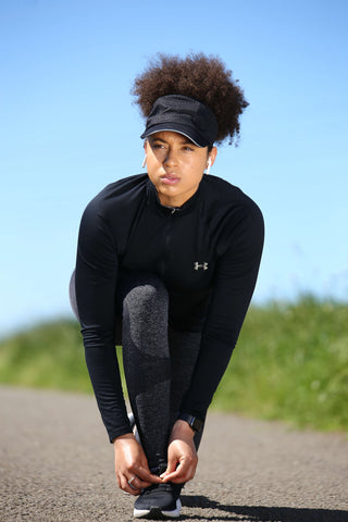 Natural Hair woman preparing to run with Beautifully Warm Backless Quick Dry Hat