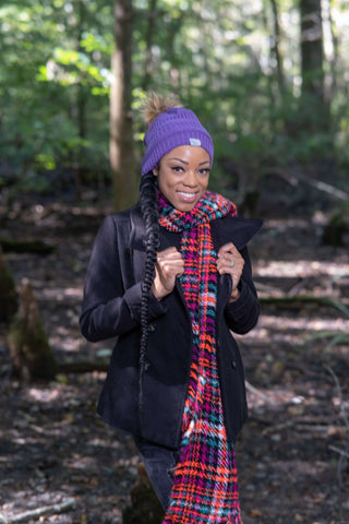 Woman outdoors in purple satin lined winter hat