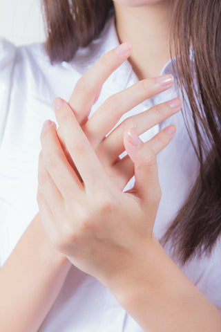 close-up of woman's hands - healthy eating - imrpove your skin - fit trax