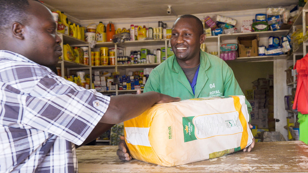 Customer in spaza shop with maize meal