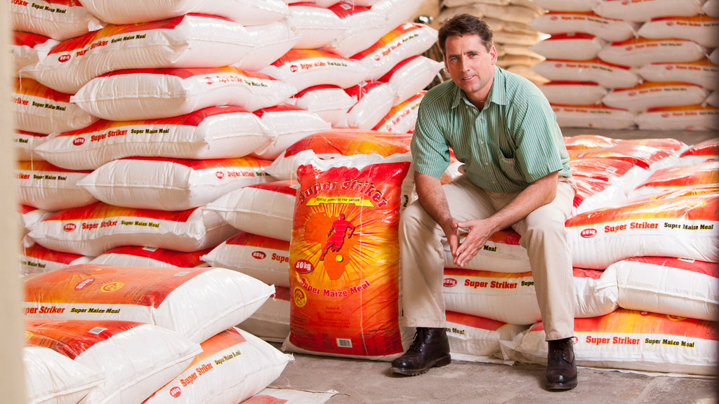 Kevin Kieser sitting on bags of maize meal