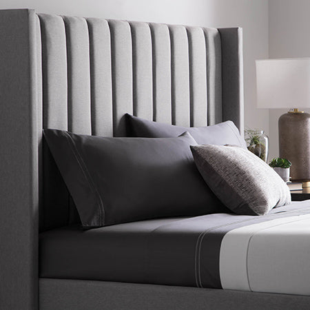 Malouf blackwell headboard with eastman bed base in stone color angle closeup