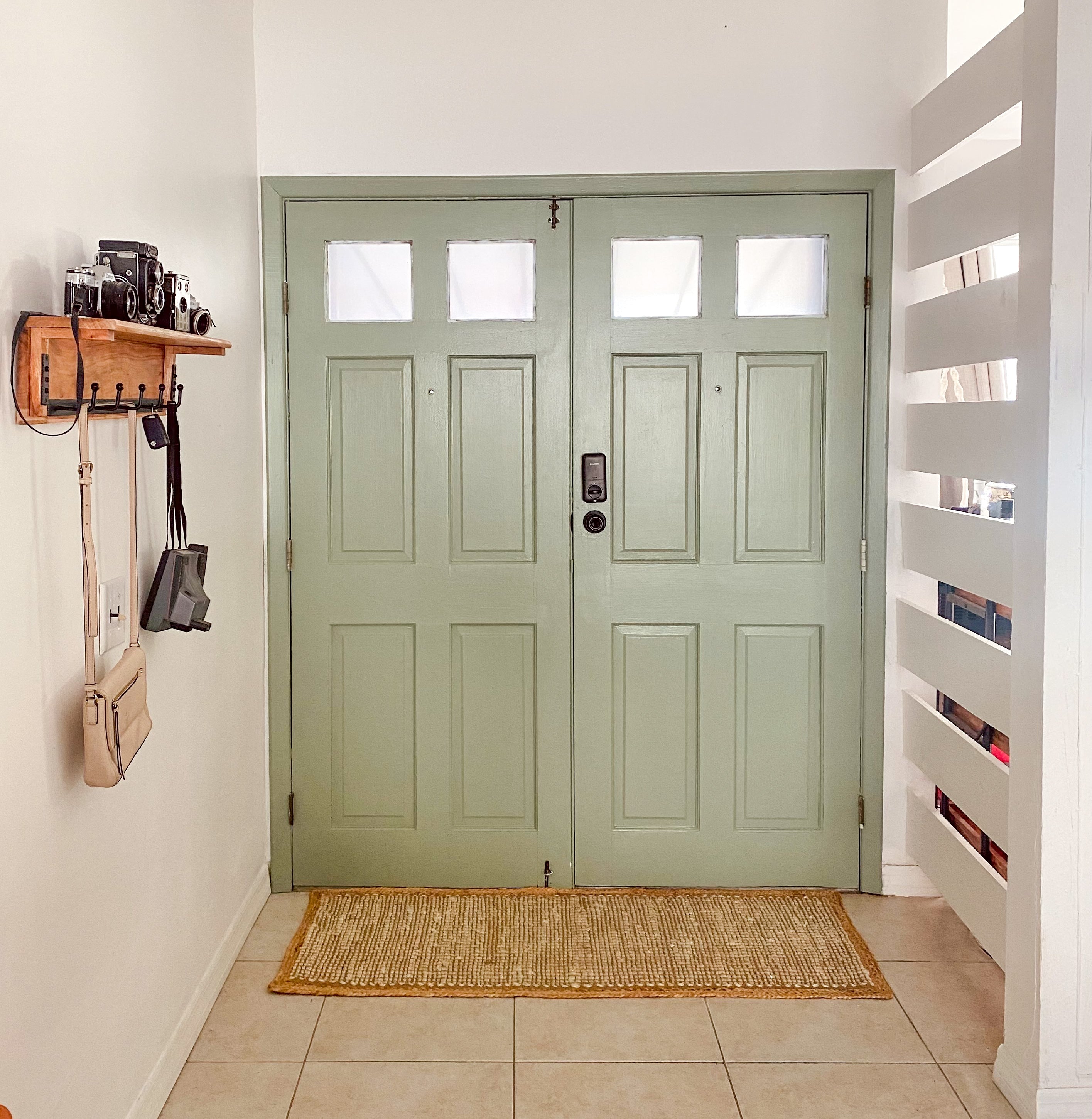 White walls with green double interior doors