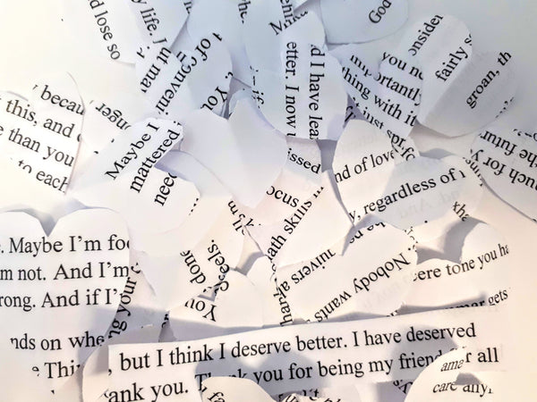 There are real love letters and poems I’ve sent that I cut into paper hearts for a school project.