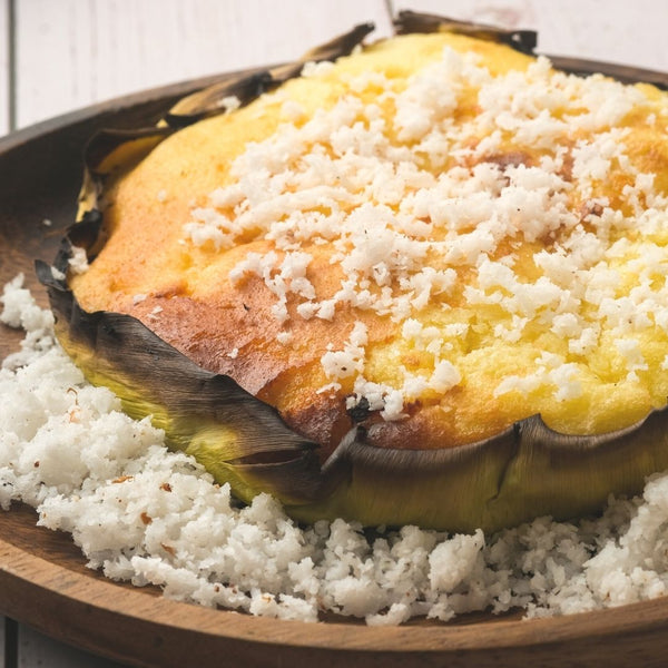 Bibingka topped with grated coconut and served in banana leaves. (Photo by Majoy Siason)