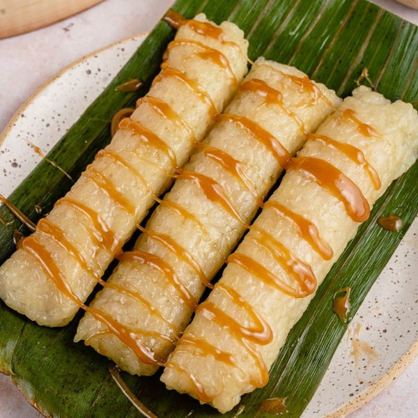 Suman drizzled with latik, a concentrated coconut milk sauce (Source: Sweet Simple Vegan)