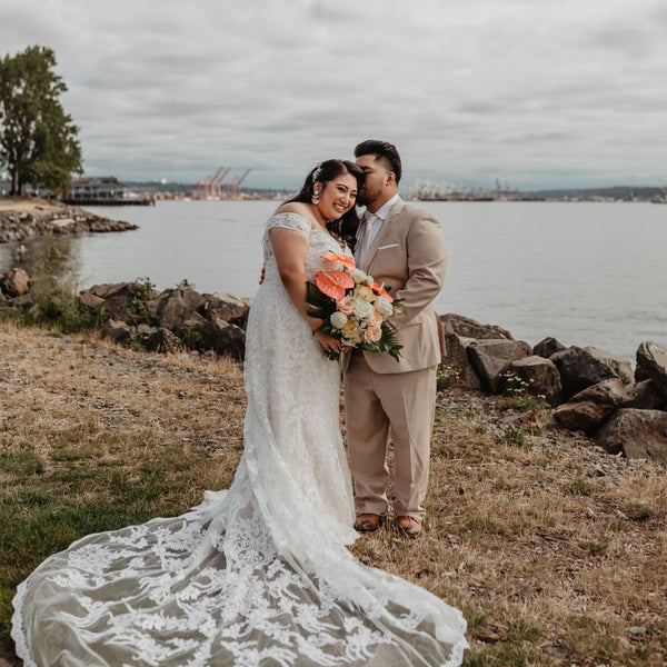 Cyril & Aga on their wedding day, sharing a quiet moment by the still waters of Seattle.