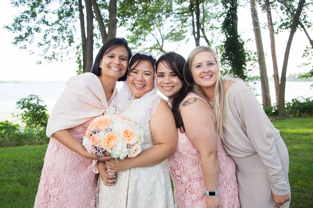 A Filipina bride with her three bridesmaids at her Filipino and Italian wedding in Montreal