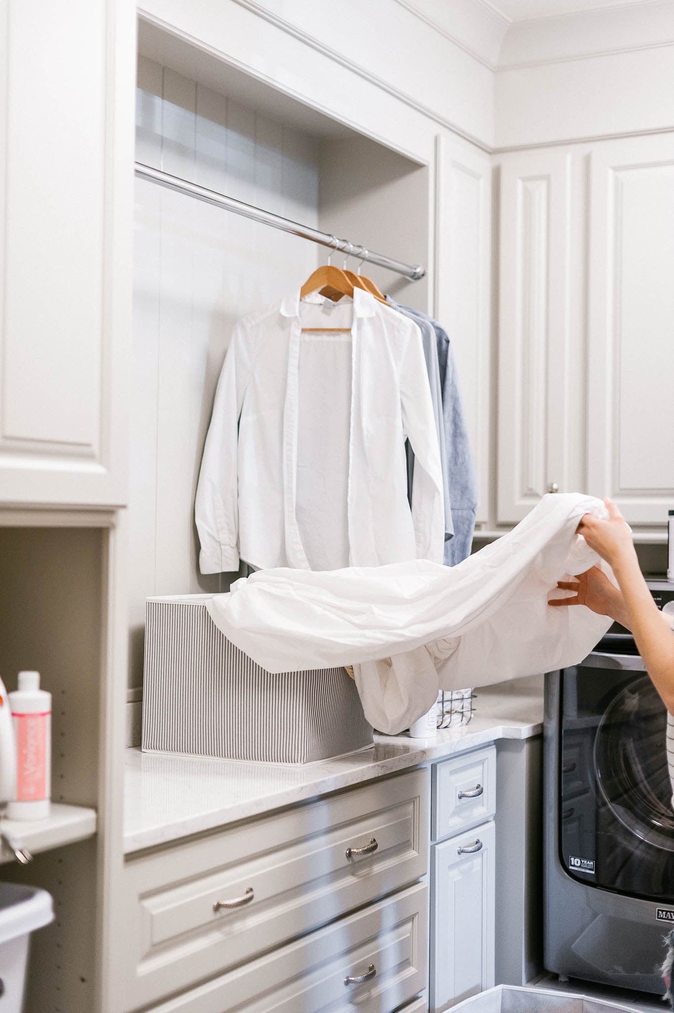 hanging clothes in a closet with forever new products