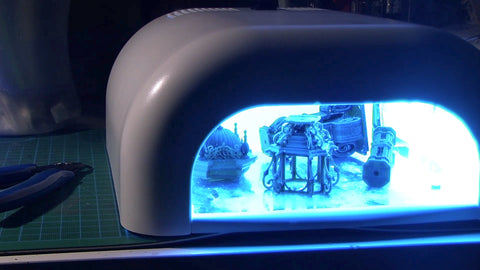 use UV lamps to clean the resin remains