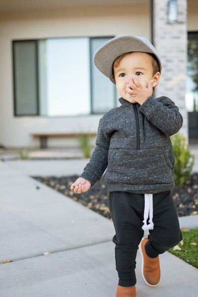 boy wearing the lowland kids half zip sweater