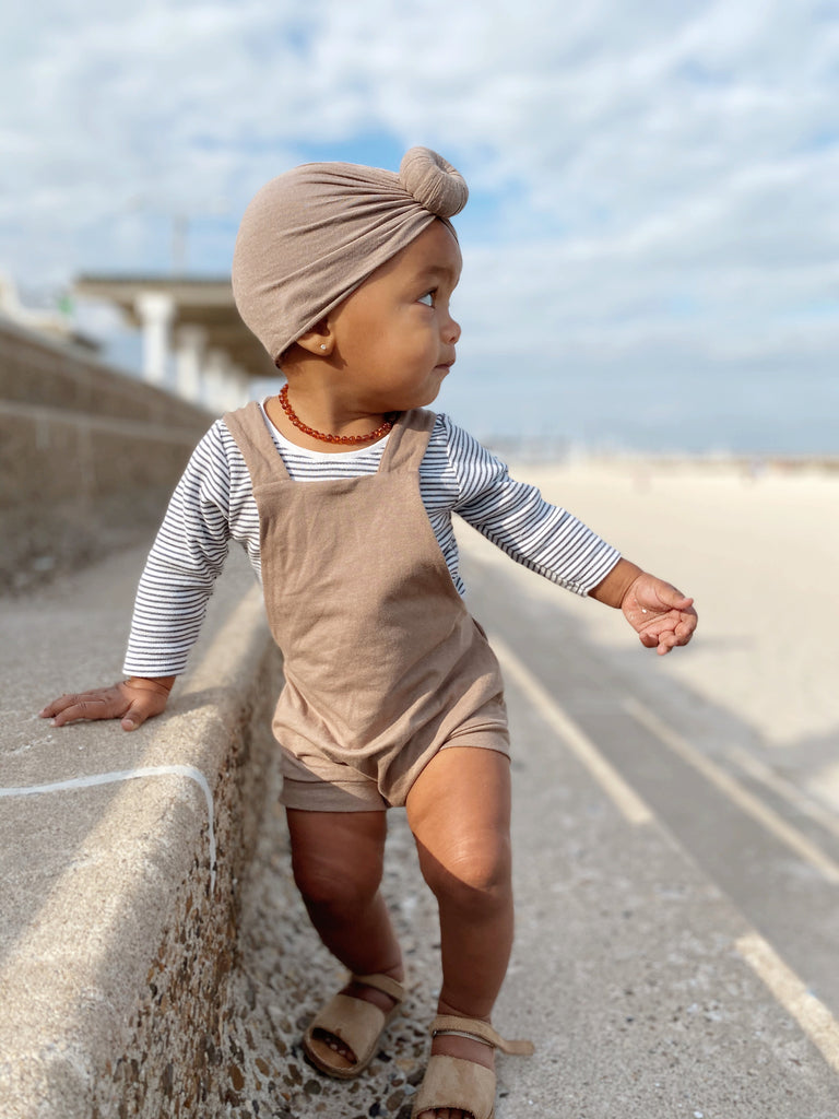 toddler wearing lowland kids overalls