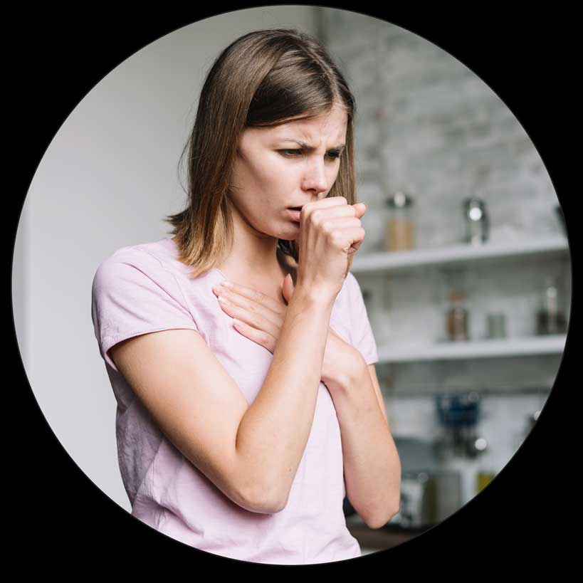 Woman coughing and holding chest FITCUPP® Helps with congestion and cough | FITCUPP® by Self Fit Inc. Contemporary Cupping Solutions
