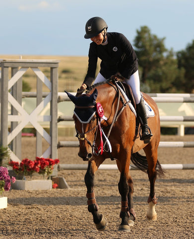 Natasha Traurig wearing Miss Shield riding helmet by Samshield with rose gold detail.