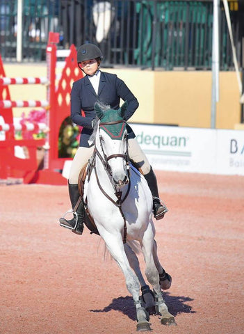 Emma Sargent at Grand Prix show wearing a Winston Show Coat.