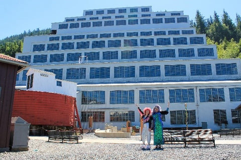 Squamish drag performers Sofa King (left) and Sativa the Diva pose in front of Britannia Mine Museum’s 100-year-old Mill No. 3 building. 