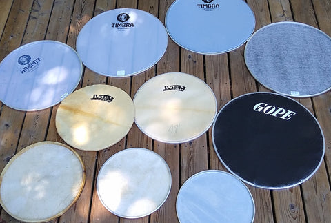 Surdo heads in many types. Timbra, IVSOM, and GOPE. Napa, plastic, goat skin, and inverted napa.