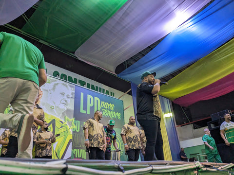 Pitty Menezes leads the community in teaching the samba.