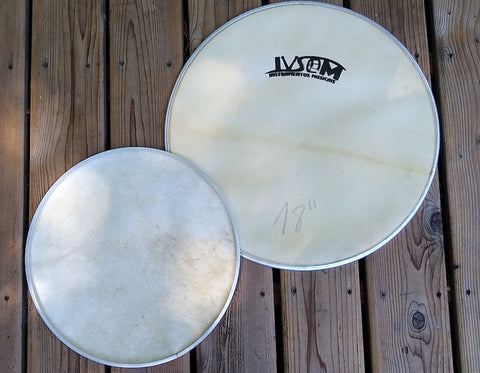 Goat skin head embedded in an aluminum hoop. IVSOM logo, front side of drum head and back side shown. 