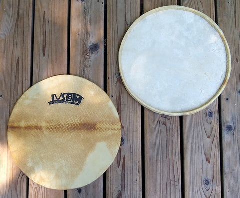 Goat skin surdo head around a wooden hoop. Front side and back side of head shown. Front view has an IVSOM logo showing.