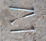 Three chocalho bolts, one is brand new and normal. The other two are worn thin. One of them is worn into two pieces.
