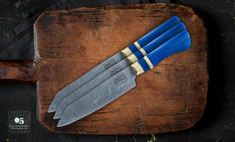 A close-up image of a beautifully crafted Damascus knife with intricate steel layering, ready for use in the kitchen.