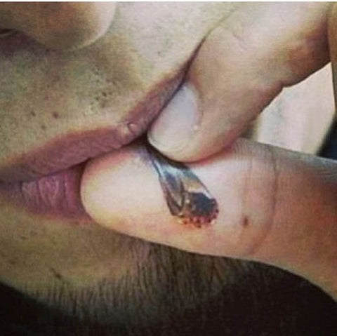 Joint Roach On Finger Tattoo