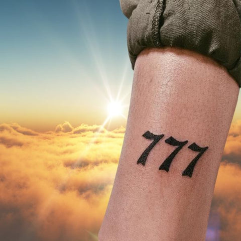 777 Tattoo Meaning What You Need to Know  Jewelry Marquis