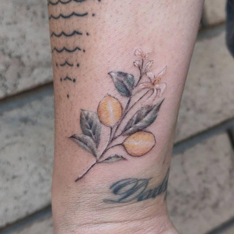 Blueberry branch by Nadia at Fleur Noire Tattoo Parlour in Brooklyn NYC   Huckleberry tattoo Wrap tattoo Body art tattoos