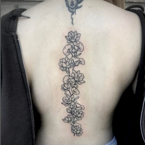 Dos Changos Locos Tattoo Studio  lotus banger A nice little lotus flower  With down the spine lettering  Facebook