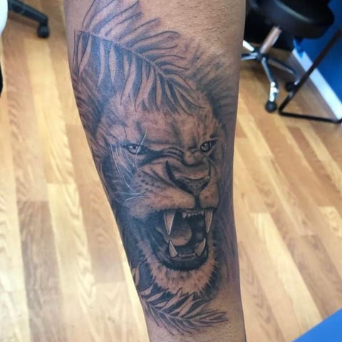 Growling Lion In the Jungle Tattoo  Best Lion Tattoo Ideas