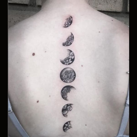 Moon phases tattoo on the spine  Tattoogridnet