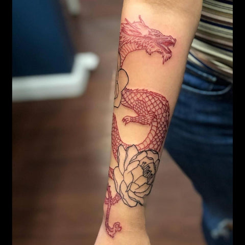 Dragon with flowers tattoo in 2023  Tattoos Dragon tattoo for women Leg  tattoos women