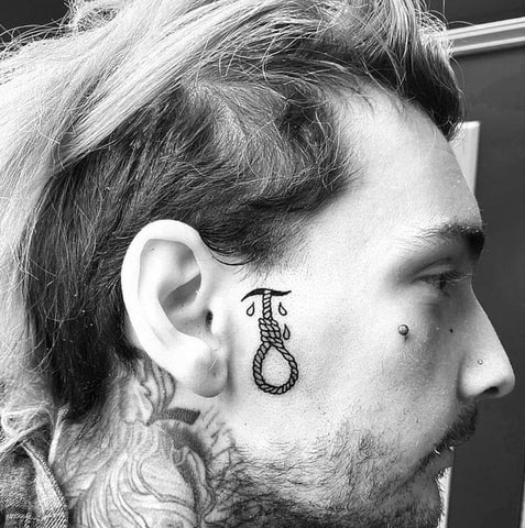 Under Sideburn Rope Face Tattoo