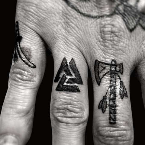 Viking ship tattoo on the inner arm