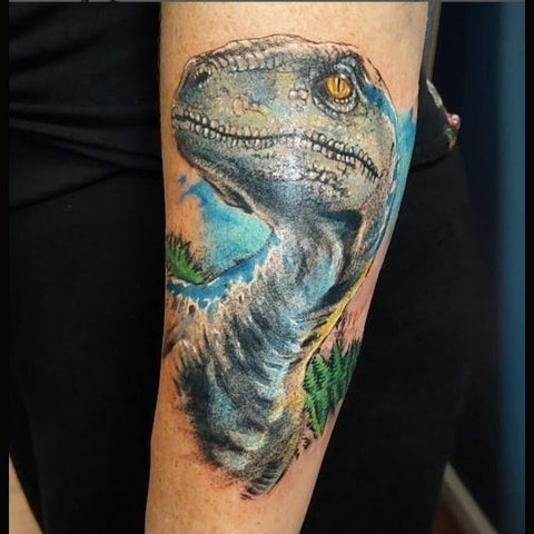 realistic raptor tattoo Best Dinosaur Tattoo Ideas