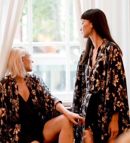 Ethical Kind Organic Peace Silk Lotus Print Kimono Gown Modelled by two models at the window