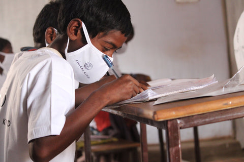 Young boy studying in class at Marghantu middle school, India JPG