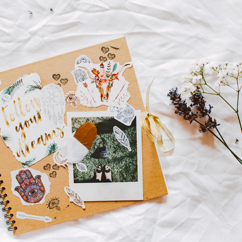 scrapbook on bed with flowers