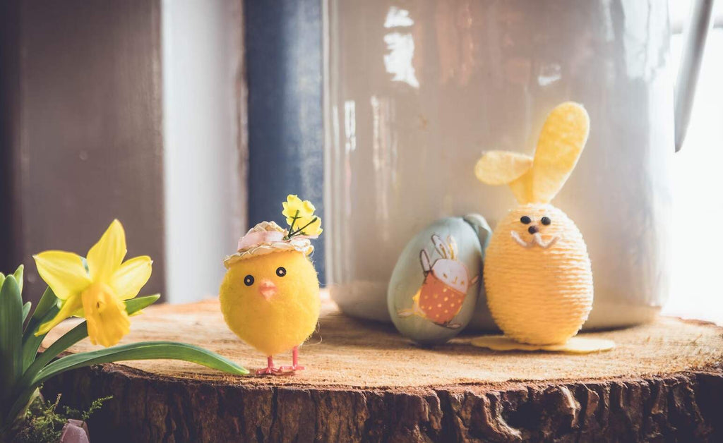 Cute Easter crafts sitting on a log table