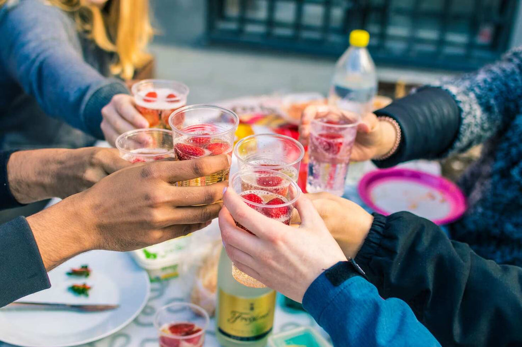 People toasting together at a spring brunch party