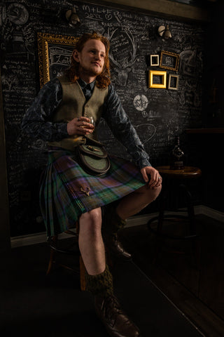 Enjoying a local dram wearing Isle of Skye Tartan Kilt with Nicolson Tweed Waistcoat