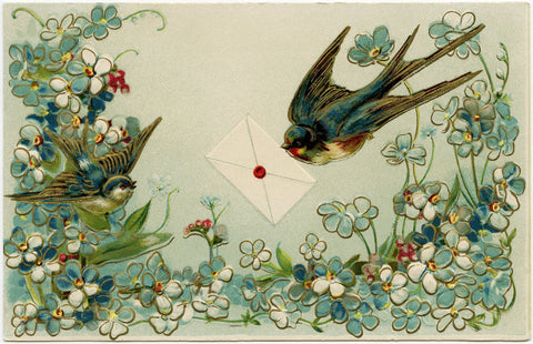 A vintage Victorian postcard with an abundant border of blue forget-me-not flowers has a single bluebird perched on the left while in the center, another bluebird swoops down with blue wings outspread, holding a letter sealed with a round red stamp in its beak. Bluebirds are often called 'bluebirds of happiness' because they are associated with being a harbinger of joy.