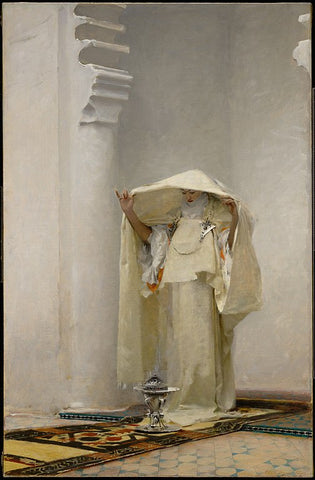 In a white marble temple a woman in pure white robes raises her veil over her head to catch the fragrant smoke from the burning incense brazier on the carpeted and mosaiced floor at her feet.