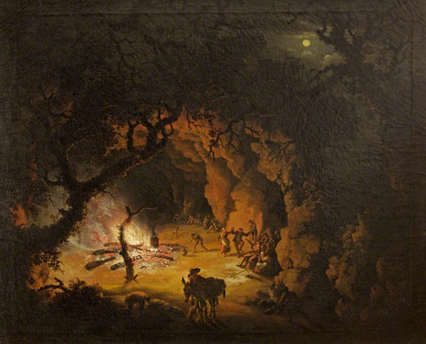 A group of people in 17th century clothing dance joyfully next to a bonfire. Shadows of tree branches arch overhead and the moon, slightly hazy with clouds, peers through.