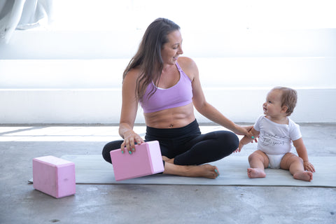 Mommy and me yoga in sweat and milk's oceane 2 nursing sports bra