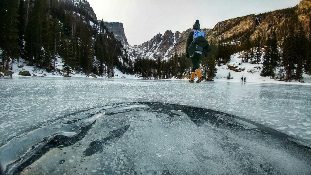 Person walking across frozen lake