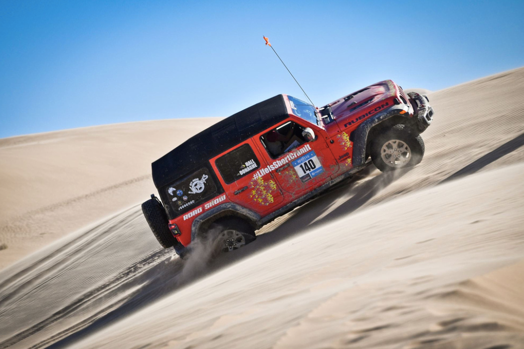 Off-roading up a sand dune.